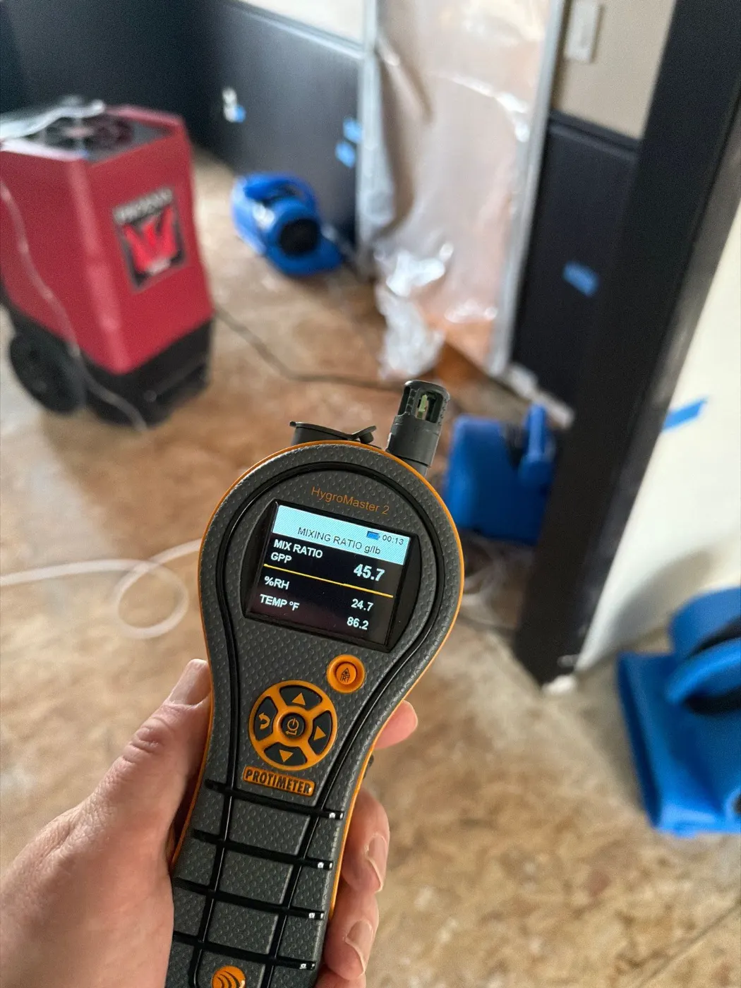 Drying setup in Rocky Ripple finished basement after water event
